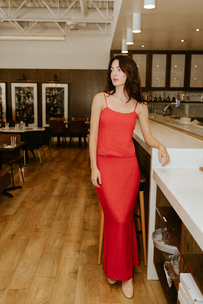 woman in matching red linen set
